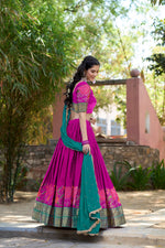 Load image into Gallery viewer, Traditional Cotton Silk Dhavani featuring stitched embroidered lehenga , unstitched embellished blouse, and sequined Georgette dupatta with lace border. Authentic craftsmanship in a complete three-piece ensemble.
